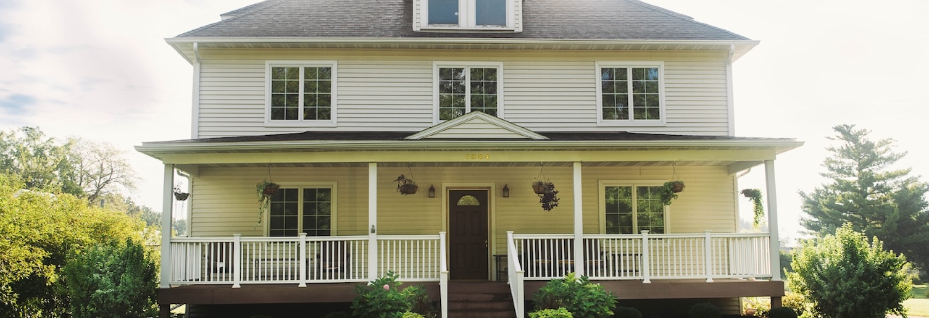 two-story white house with open front porch